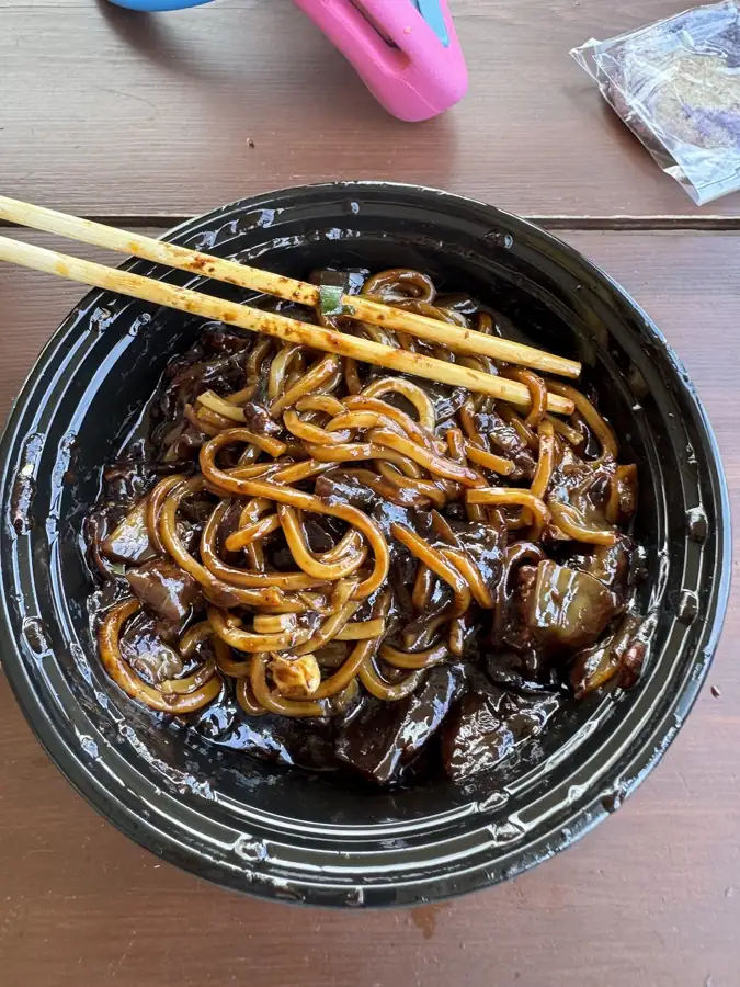 A bowl of jjajangmyeon, noodles in black bean sauce