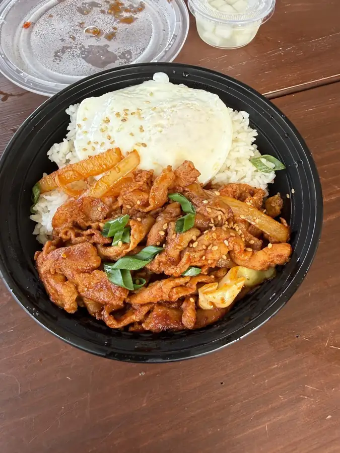 A spicy, gochujang-glazed bowl over rice